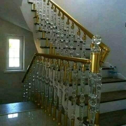Bespoke brass and crystal staircase balustrade with gold handrail