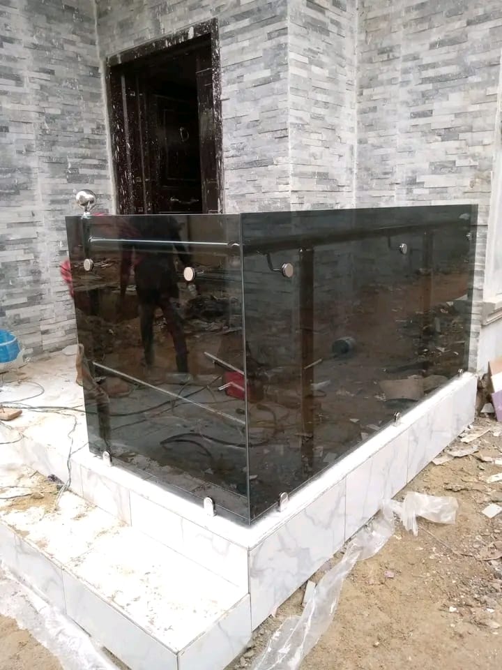 Tinted glass balustrade with stainless steel fittings